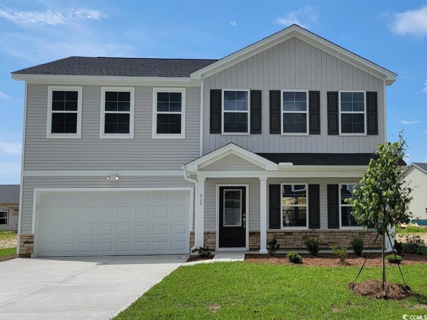 View of front of property with a garage and a fron