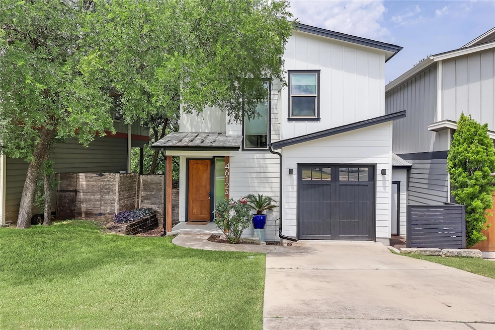 View of front of house featuring driveway, an att