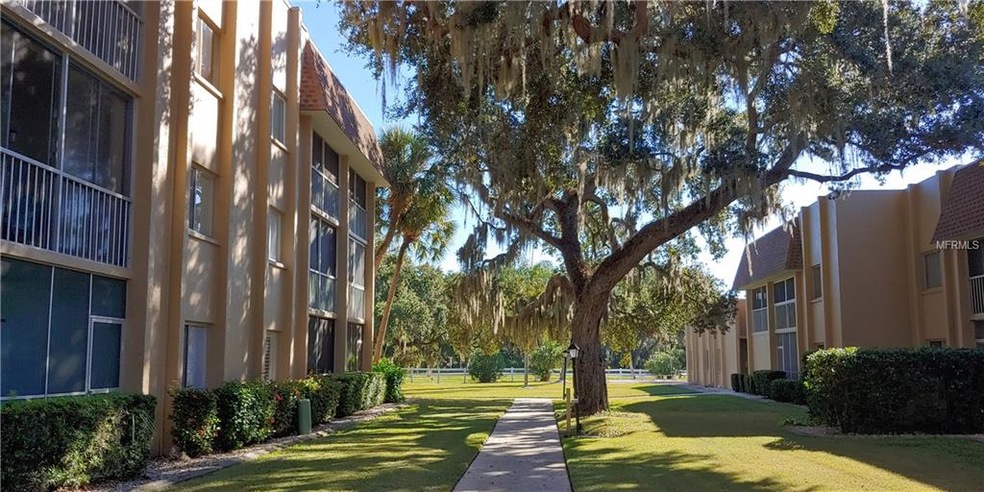 MATURE OAKS ON MANICURED GROUNDS