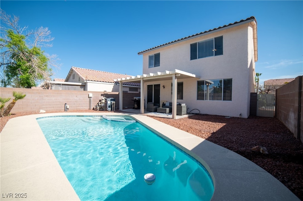 View of pool featuring a fenced backyard, outdoor