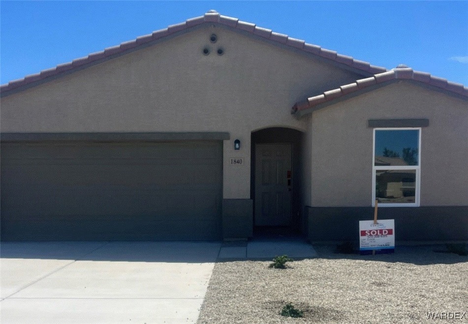 View of front of property with a garage