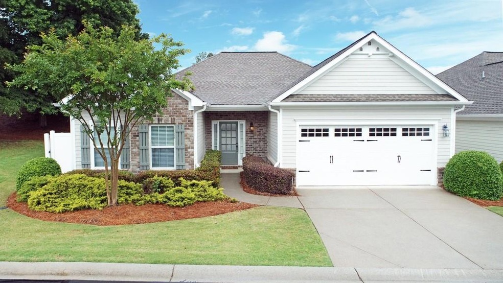 View of front of house with a garage and a front l