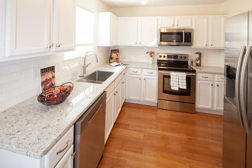 The Kitchen has stainless steel appliances that are about 2 years old. The Samsung Refrigerator is new and has an ice maker and water dispenser on the front.