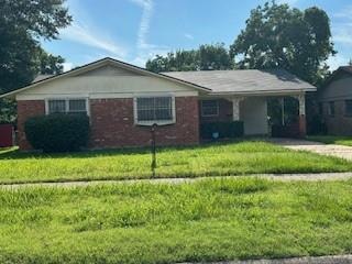 Single story home with a front lawn and nre roof