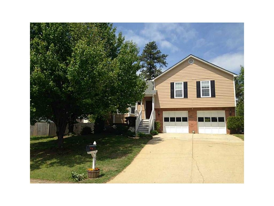 Exterior Front. Brick, Cement siding, two car gara