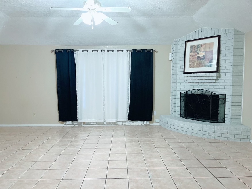 Spacious Living Room with cozy fireplace