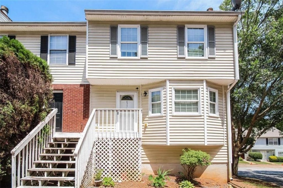 View of front of house with brick siding and stair