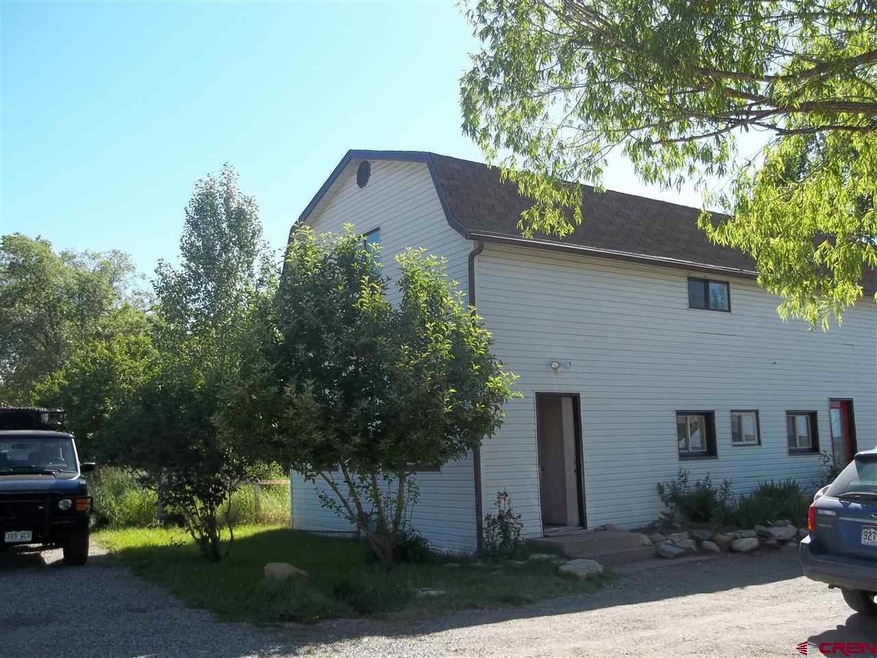 Gambel style contemporary farmhouse on frontage ro