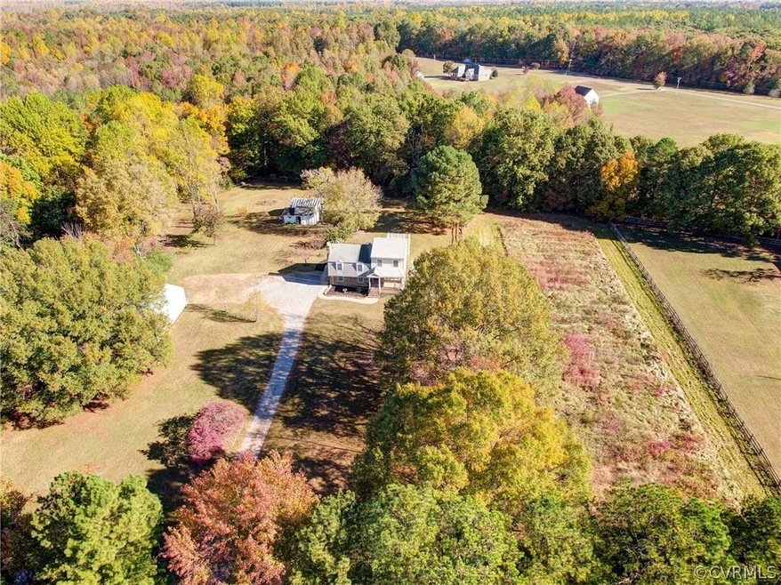 Property is rectangular and runs along the fence line seen here on right to a fence line blocked by the lake trees on left, perimeter is mowed in this view.
