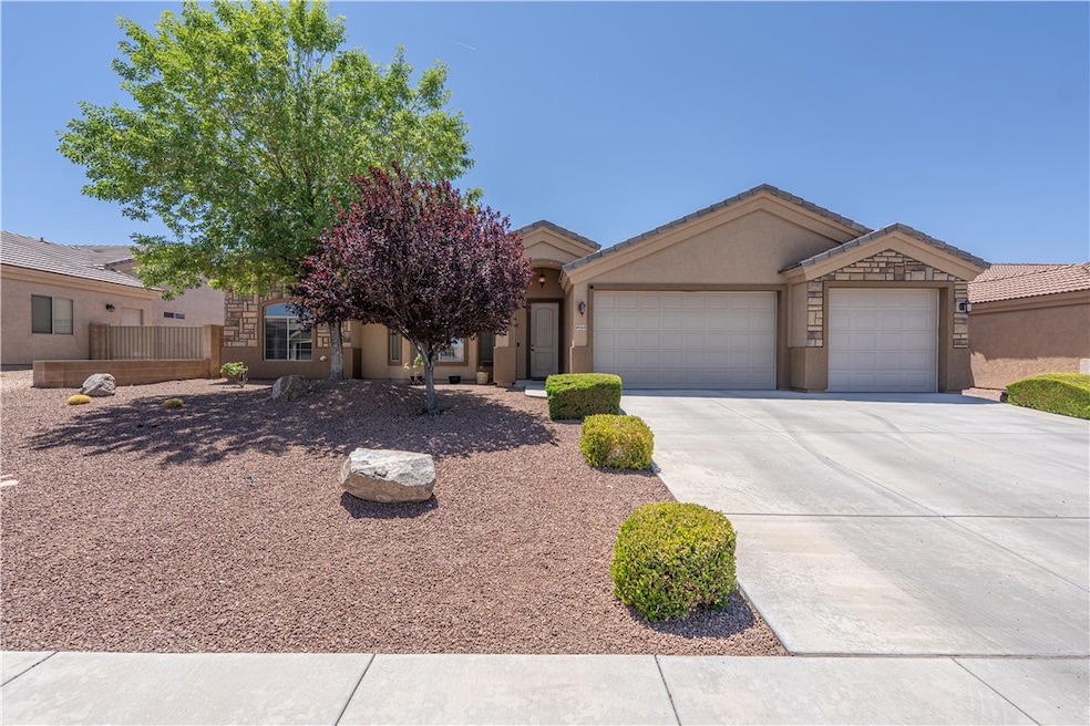 View of front facade featuring an attached garage,