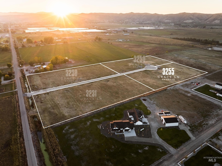 Aerial view at dusk of a mountain view, a view of countryside, and property parcel outlined