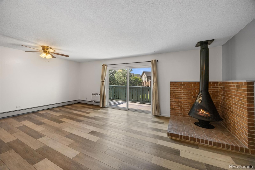 Living room with large rear slider that opens to a quite private patio