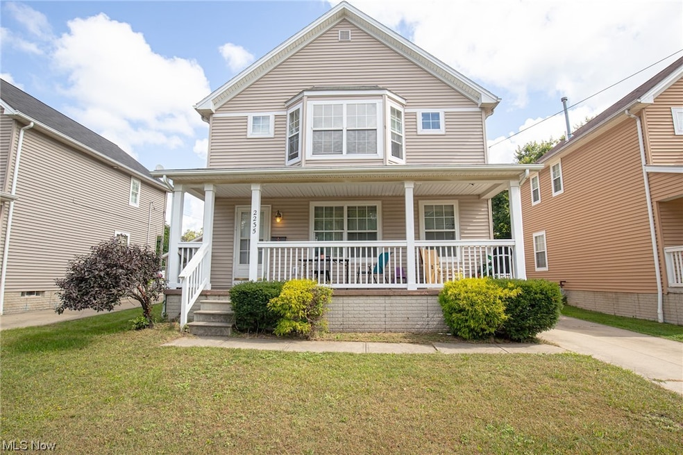 View of front facade with a porch and a front yard
