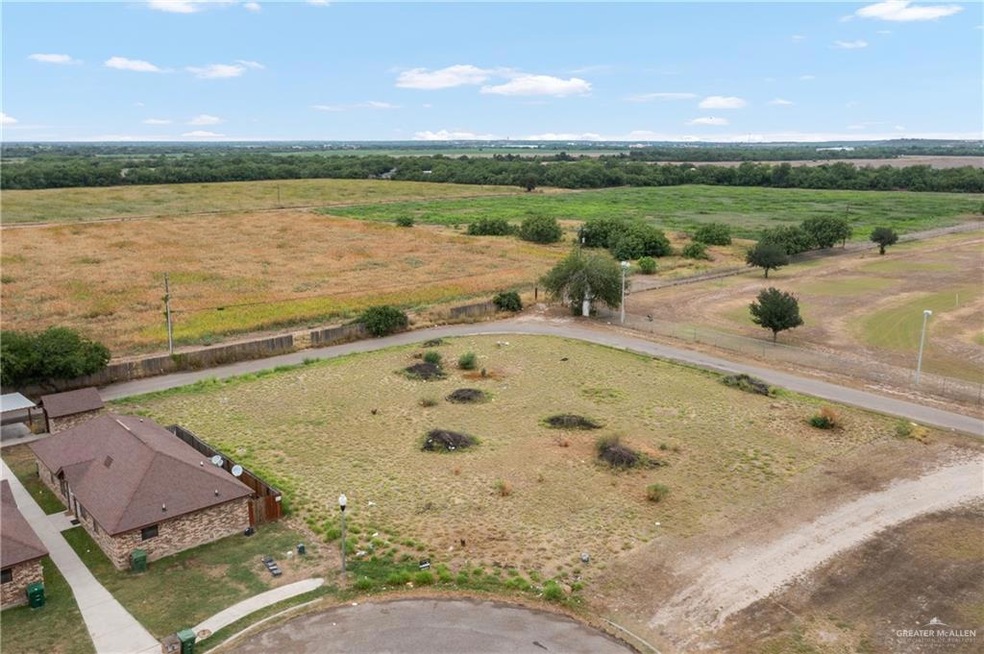Birds eye view of property featuring a rural view