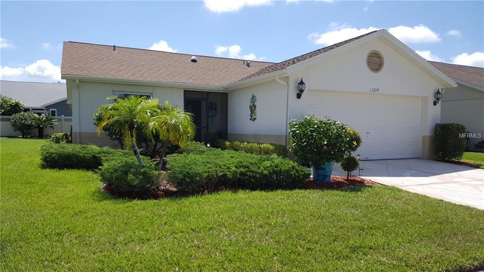 FRONT VIEW, NICELY LANDSCAPED YARD.