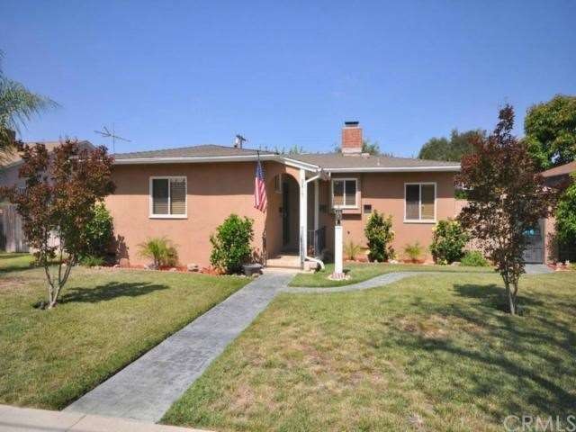 Front of home with rain gutters.