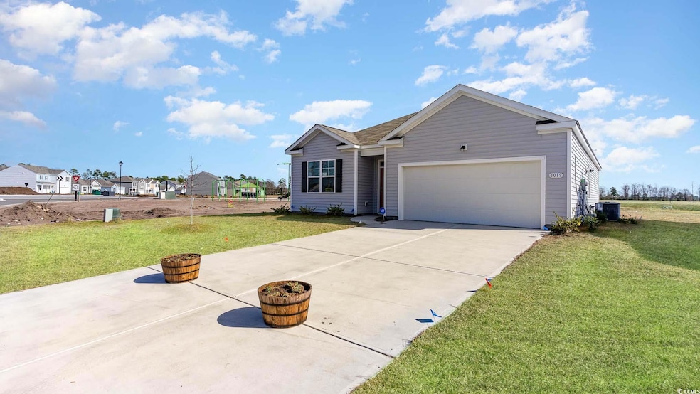 Single story home with a garage, a front lawn, and