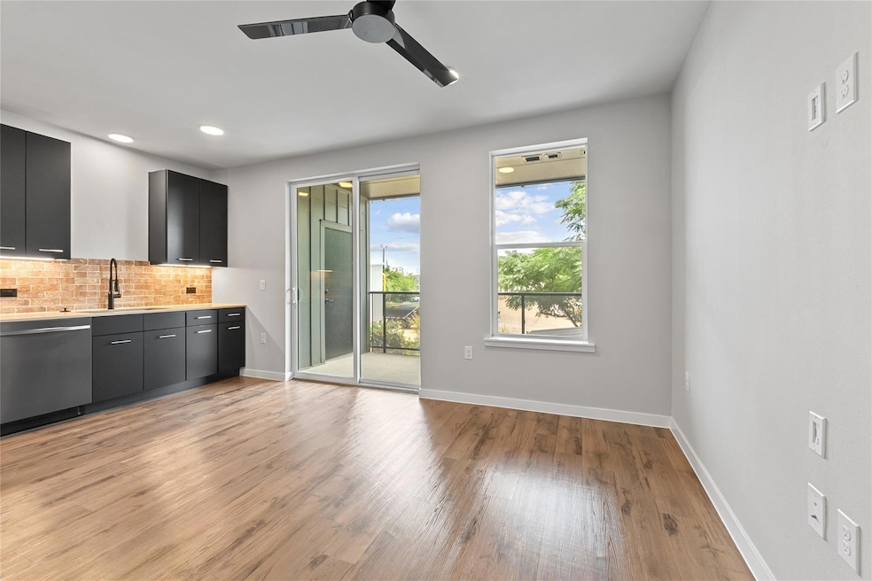 Kitchen featuring dishwasher, tasteful backsplash