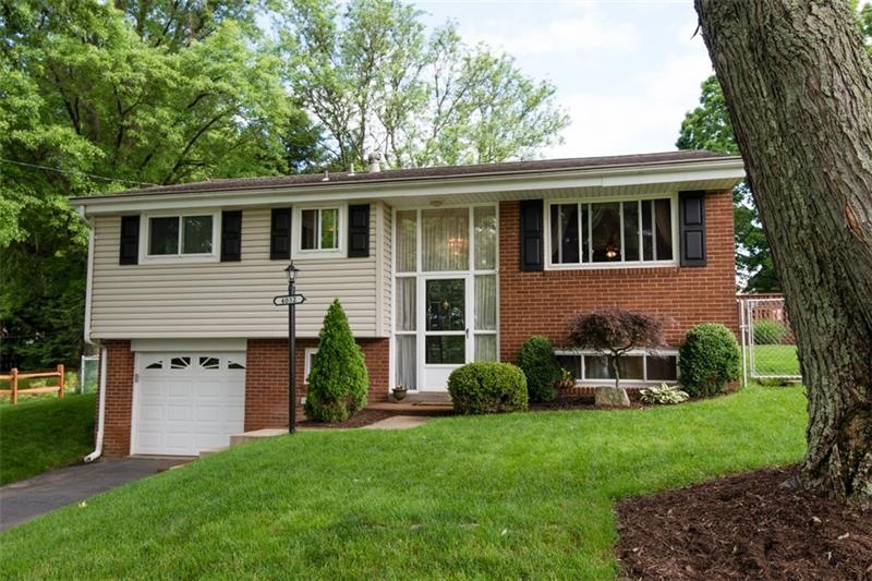 Exterior showing newer windows, siding, and garage