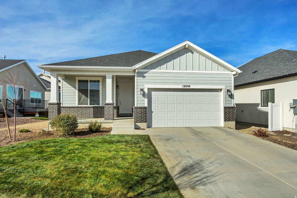 View of front facade with brick siding, a porch, board and batten siding, concrete driveway, and an attached garage