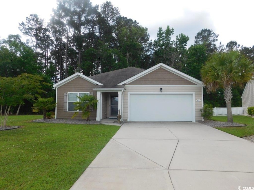Single story home with driveway and an attached garage