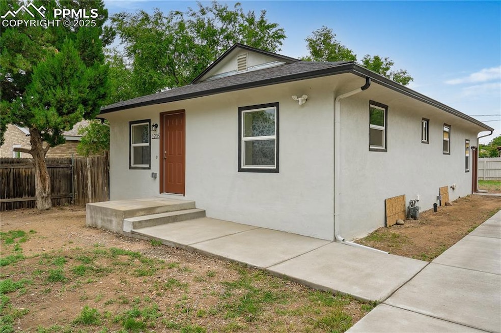 View of front of property featuring stucco siding