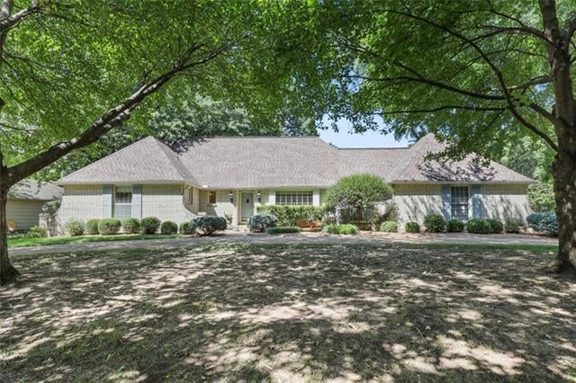Beautiful ranch style home with circle drive and s