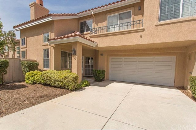 Front of home. Attached 2 car garage accessed by e