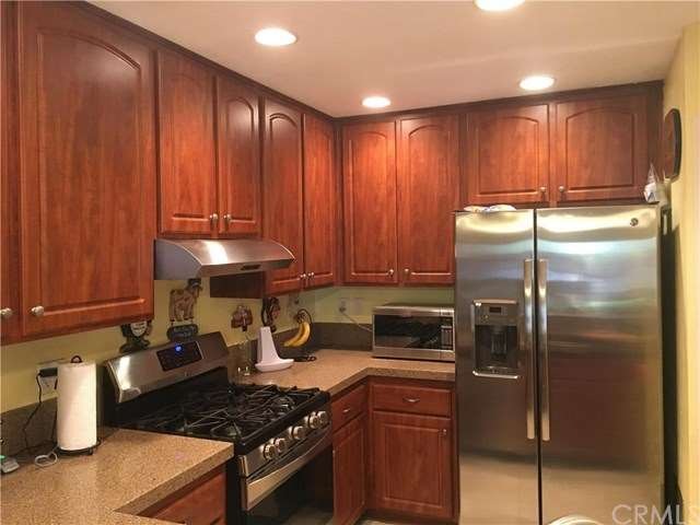 Granite Countertops, Cherry Cabinets...tons of cab
