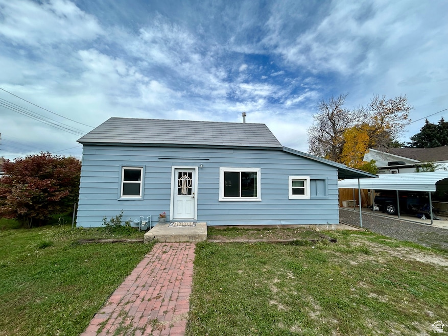 Bungalow-style home featuring a front yard