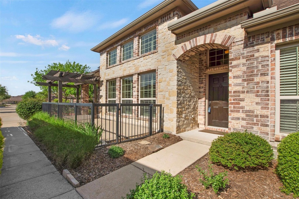 View of exterior entry featuring a pergola, stone 