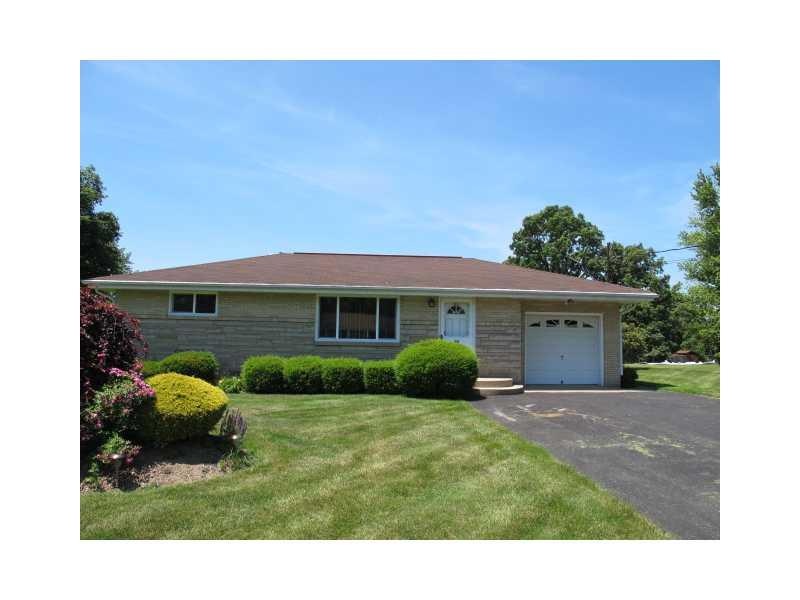 Exterior Front. Beautifully landscaped exterior wi