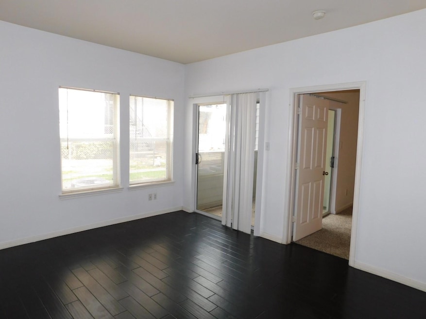 Spare room featuring baseboards, a smoke detector