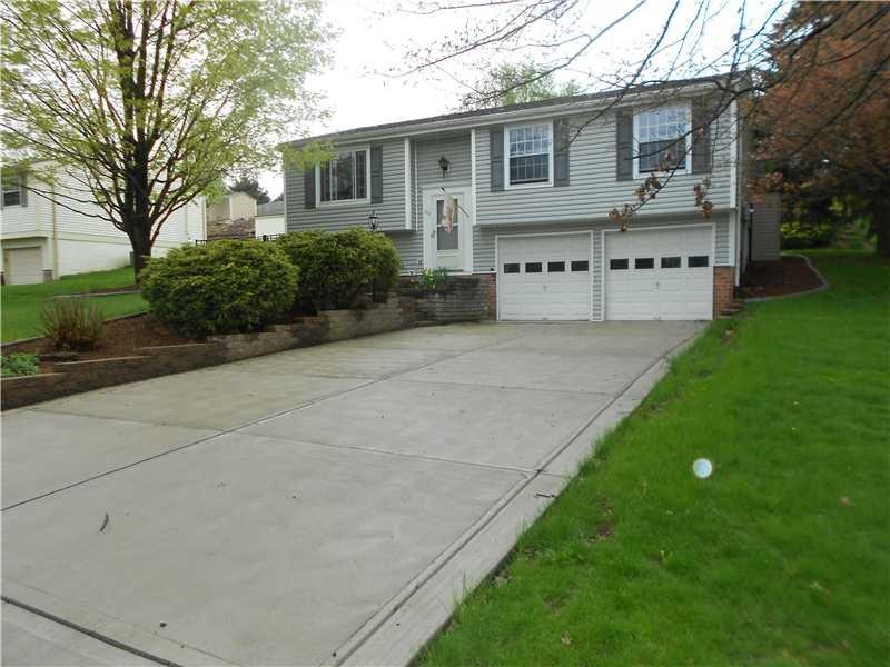 Exterior Front. Updated concrete driveway, garage 
