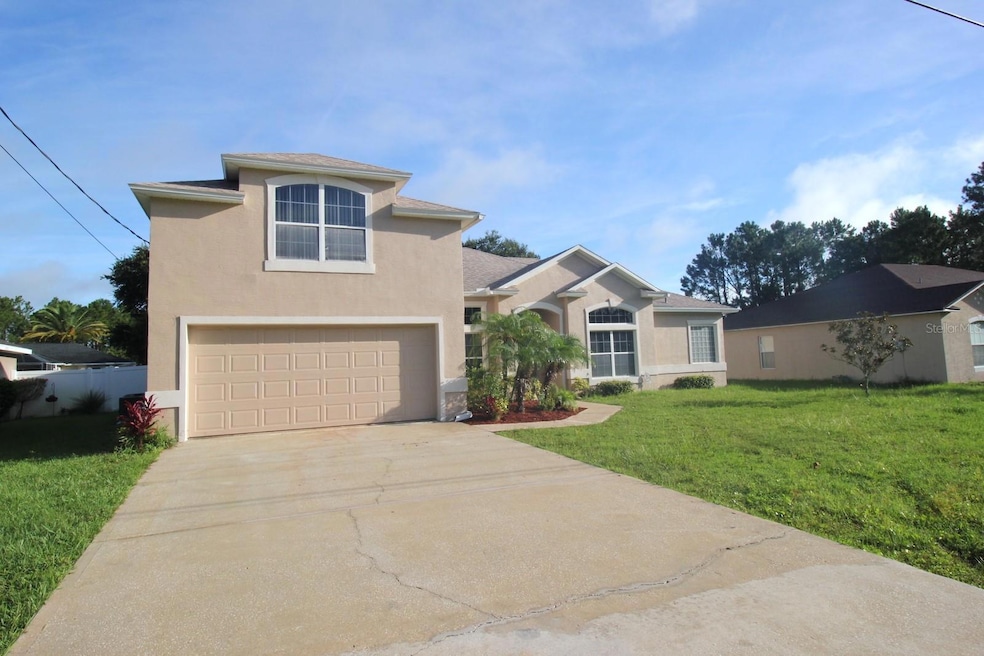 25 Bird of Paradise Dr, Palm Coast, FL 32137 - photo 1