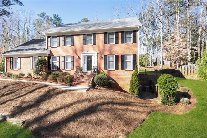Beautiful brick home on a 1 acre lot in a great lo