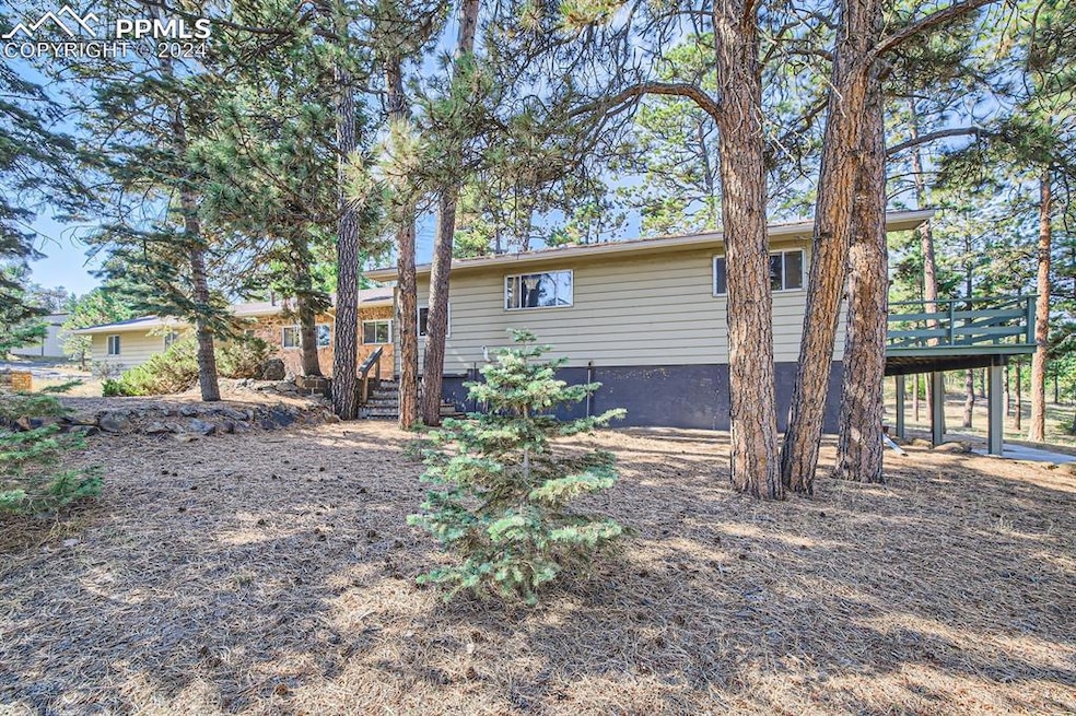 Front view of property featuring a deck