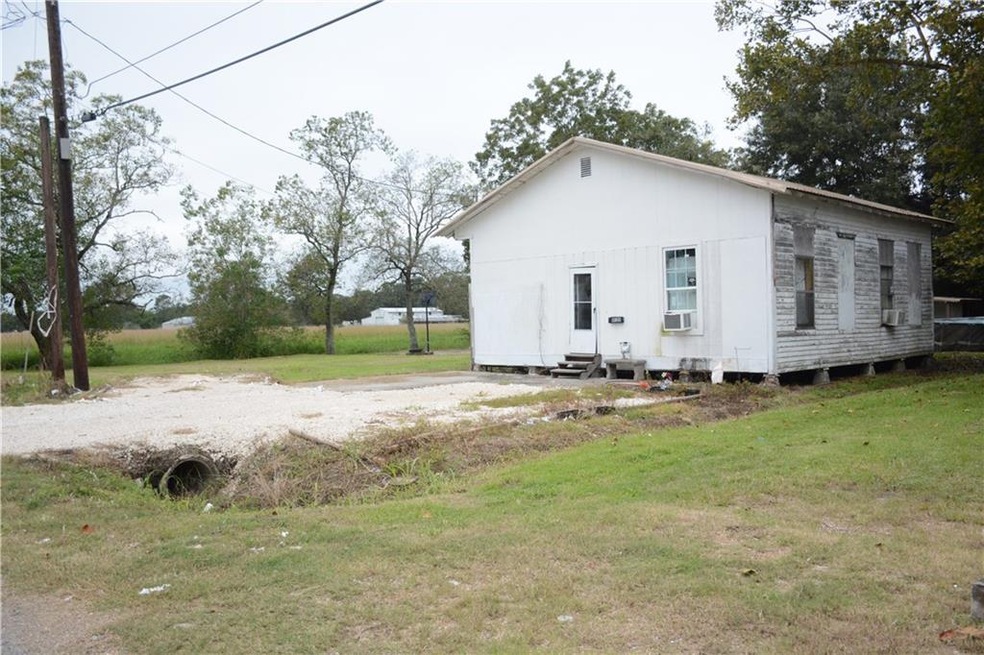 Front elevation with view of adjacent lot (left si