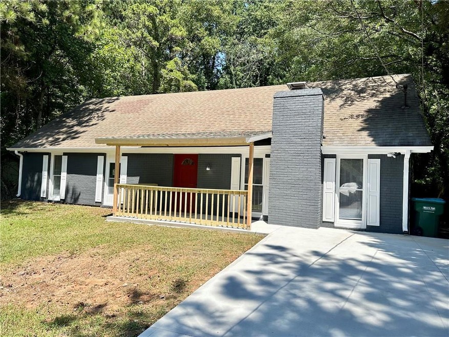 Ranch-style home featuring a front lawn