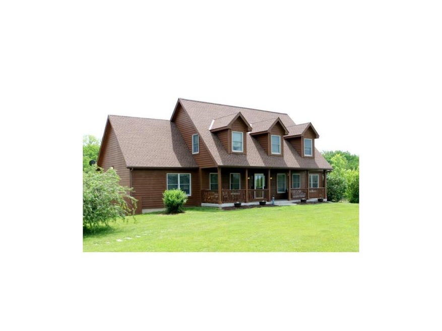 Custom Built Cape Cod/Lodge Style Home on 20 Acres! Large Covered Front Porch, Mature Trees separate Home from Road, Smithville School District, Minutes from Smithville Lake!