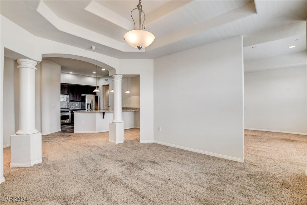 An open floor plan with 10ft ceilings and architec
