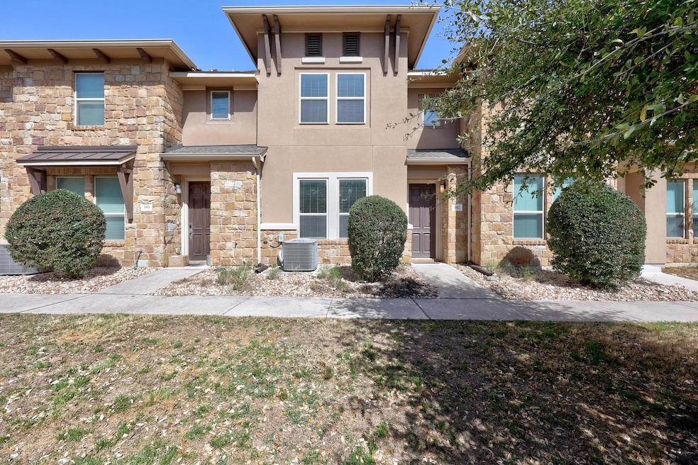View of front facade with stucco siding, stone si