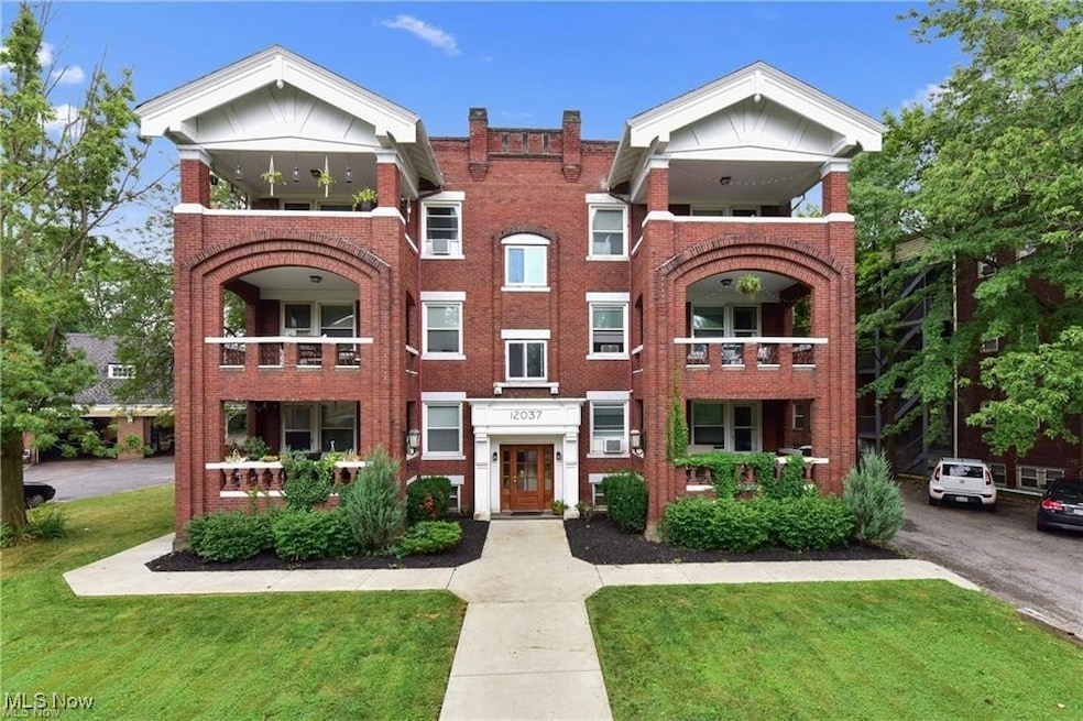 View of front of house featuring a front yard and brick siding