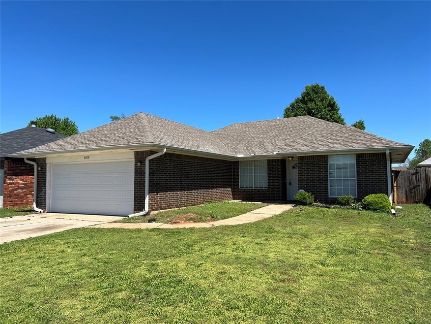 Ranch-style house featuring a garage, fence, a fro