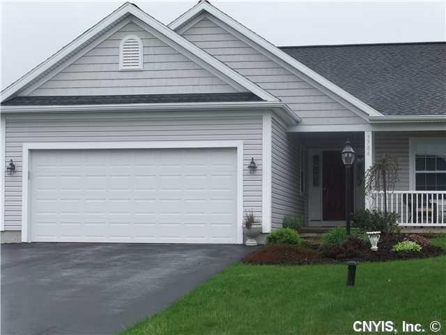 Exterior Front. 2 car garage and a great covered p