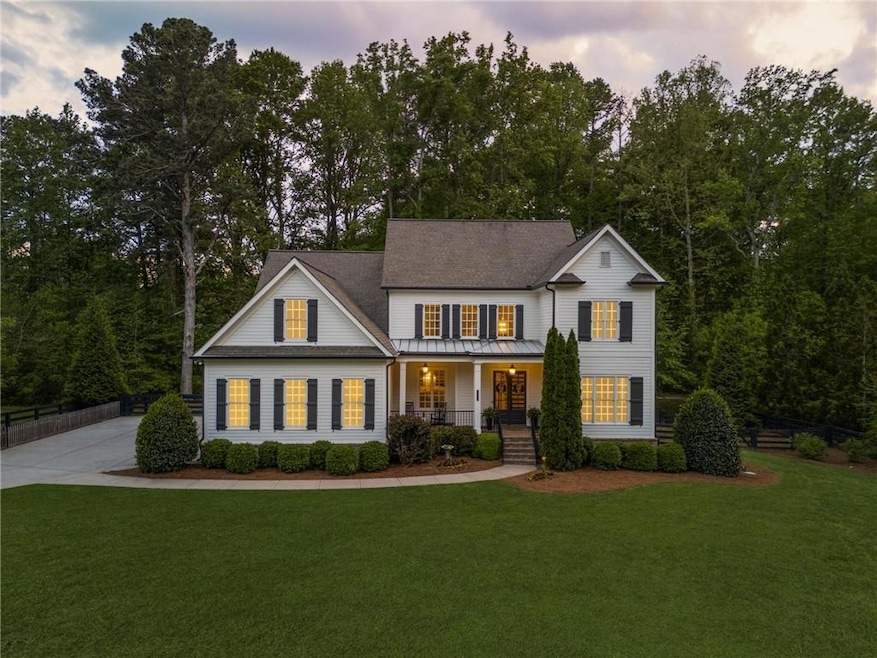 View of front of property with covered porch, a st