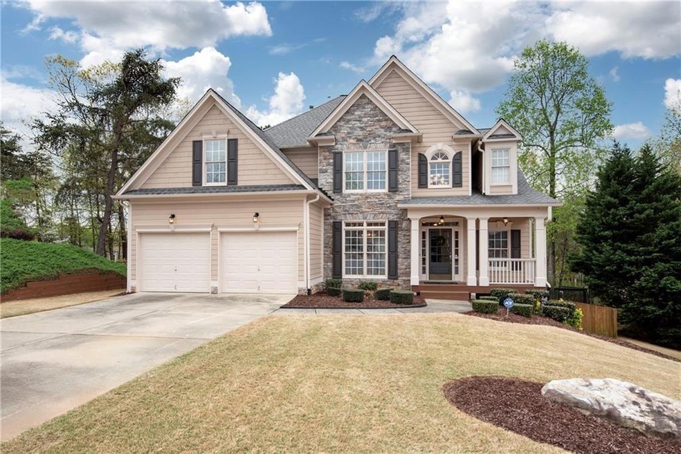 View of front of home featuring a garage, a front 