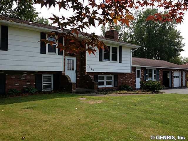 Exterior Front Beautiful raised-ranch with brick e