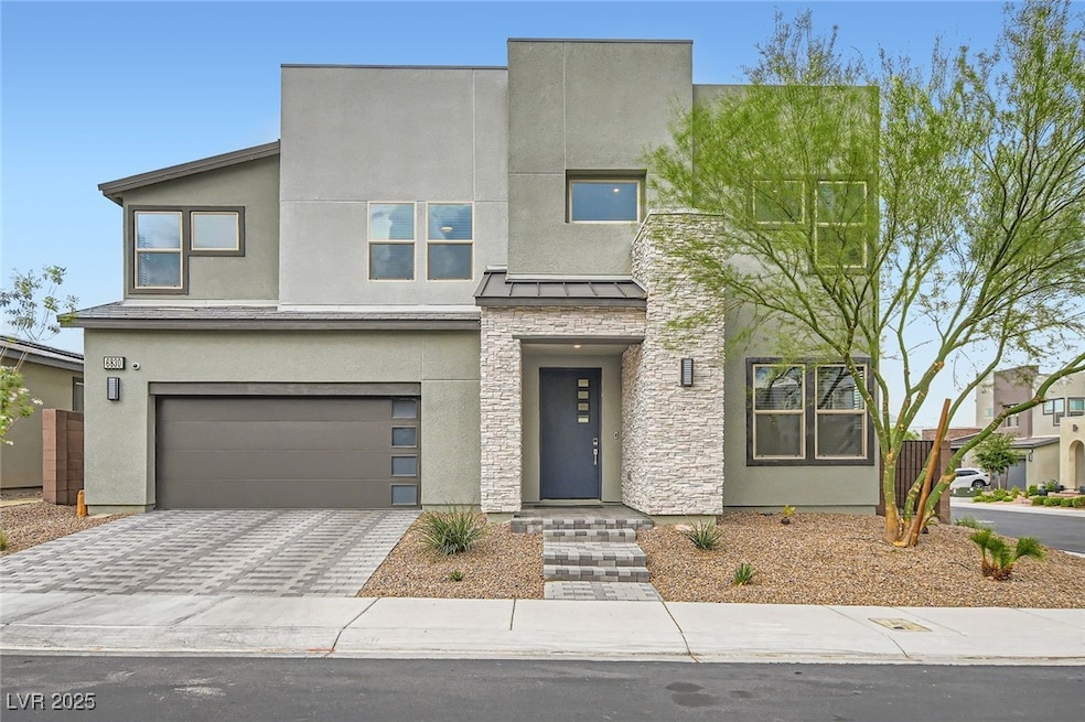 View of front of property featuring an attached ga