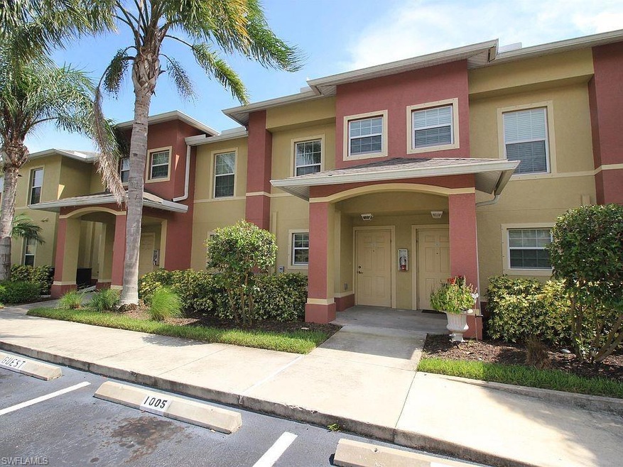 Multi unit property with stucco siding and uncovered parking